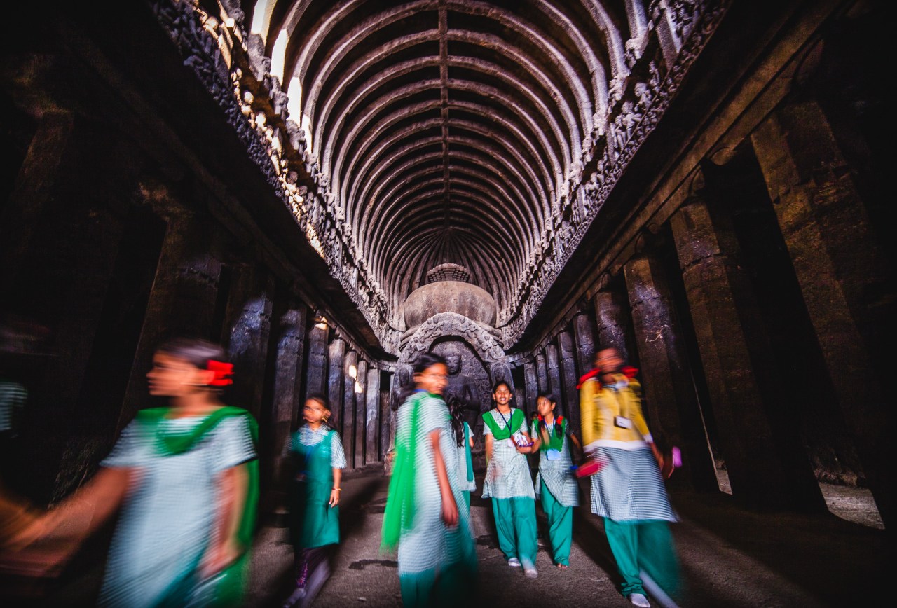School field trip. The caves may have been deserted for over 1100 years, but now they are the destination of all the schools in the area and many more from afar. The quiet meditative caves are then transformed into school playing halls where laughs, games and shoutings would hardly have any interruptions. Still the ballet was very well orchestrated, with all the groups having a group leader and ID cards, the joyful and agitated spirit was surprisingly getting all quiet when all the kids would line up perfectly before getting out of each cave, getting ready to move on to compromise the next one! Ellora. Maharashtra, India, 2014.