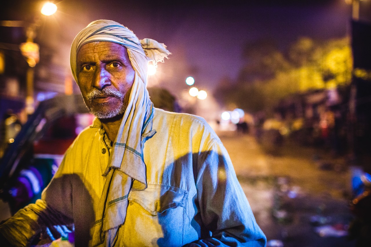 The Albatross. Wandering at night in Varanasi, the city is silenced by the occasional electricity cuts, all human traffic terminated, only some cows are roaming from one trash pile to another and dog packs are abruptly running and barking along the ghats. The cycle rickshaw driver is still down here, the street is his workplace and his rickshaw his bed. When you're out there, you're out of touch. He was setting up to rest, we exchanged looks. We had nothing to say, but it wasn't because we didn't know enough, we just knew too much. I had a thought for the Flowers of Evil. Varanasi, Uttar Pradesh, India, 2014.