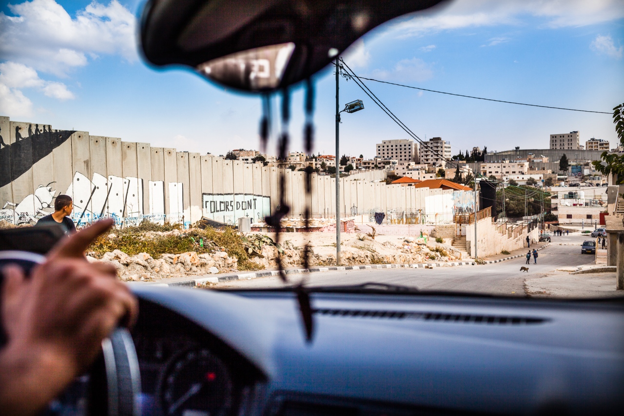 Driving around the Segregation Wall. Bethlehem, Palestine, 2014.