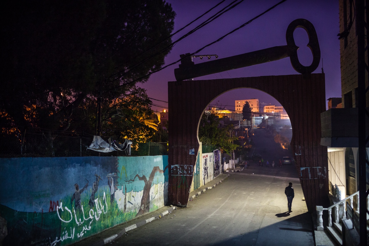 The door of the Aida Camp, in the background, a door entrance to Israel on Segregation Wall. Bethlehem, Palestine, 2014.